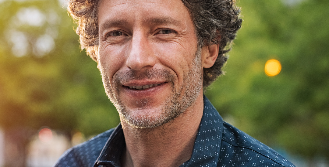 profile image of a man with curly hair